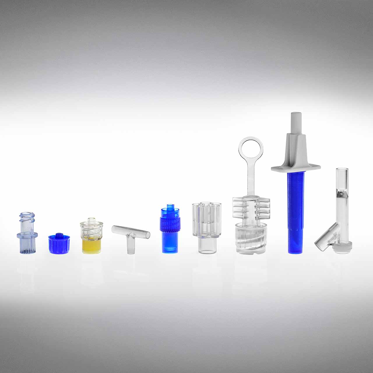 An assortment of plastic components by Adam Spence Corporation